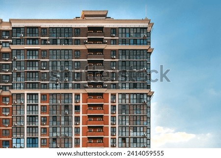 Multi-storey residential buildings. View of a multi-storey building against the blue sky.The concept of urban construction. A newly built residential complex. 