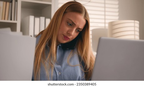 Multitasking busy Caucasian businesswoman talking phone call check papers documents working laptop in office stress many task girl woman talk smartphone work computer doing paperwork business problem - Powered by Shutterstock
