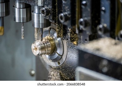 The multi-tasking CNC lathe machine tapping the brass fitting parts. The hi technology parts manufacturing process by multi-tasking CNC turning machine.