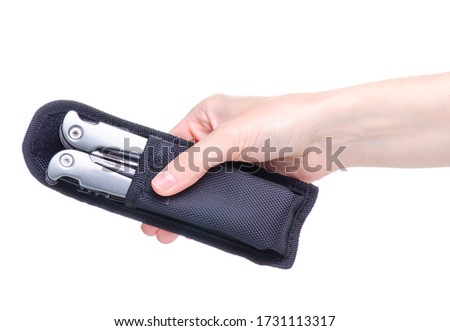 Multitool multi function tool hovers in hand on white background isolation