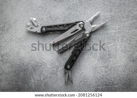 Multi-tools pliers with other tools and knife. Multifunction pliers.