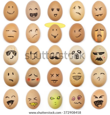 multitude of different smiley faces drawn on the eggshell on white background