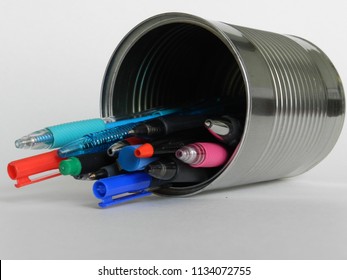 Multitude of pens in silver tin can closeup - Powered by Shutterstock