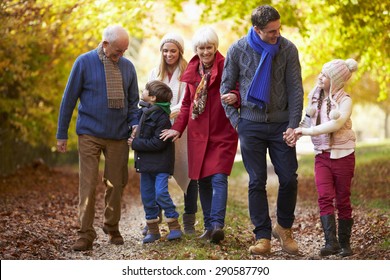 Multl Generation Family Walking Along Autumn Path - Powered by Shutterstock
