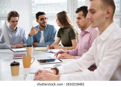 Multy-ethnic Group Of Business People Working At The Office Desk