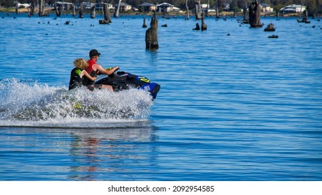 Mulwala, New South Wales Australia - October 31 2021: Adult And Child On A Jetski Having Fun On Lake Mulwala NSW Australia