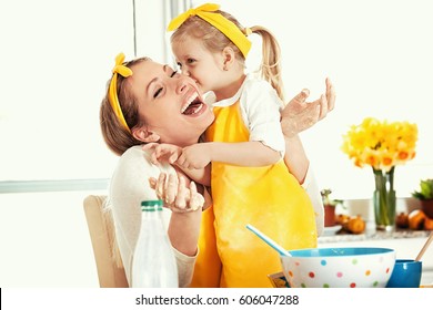 Mum And Daughter Baking Cakes. 