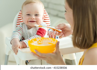 Mum Spoon-feeds The Child