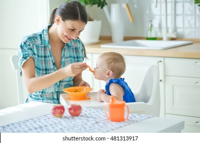 Mum Spoon-feeds The Child