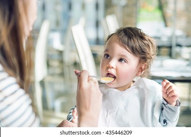 Mum Spoon-feeds Her Child