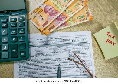 Mumbai, India- 1 Aug 2021: Indian Income tax return form ITR-1 return form is on the table along with Indian currency. Tax filling concept 2021.Selective focus.