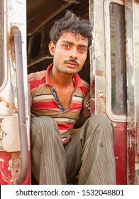 Mumbai, India - 2/2/2011:  The Driver Of A Garbage Truck For The Dharavi Slum Area.