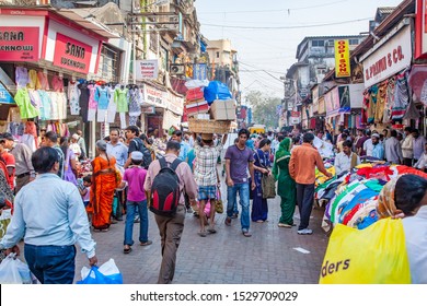 Mumbai, India - 2/2/2011:  Local Indian Men Amd Women Shopping At A Crowded Street Market In Mumbai, India