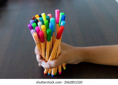  Mumbai, India - 24 October 2021-Colorful Point 88 Pens By Stabilo Held In Hand On Study Table Along With A Blank White Paper For Study, Art, Journaling, Bullet Journal, Planner, Drawing, Mandala.