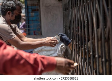 Mumbai / India 5 May 2020 Men Purchase Alcohol From A Government-controlled Outlet In A Prem Nagar Teen Dongri Goregaon West During Lockdown Period In Mumbai Maharashtra India