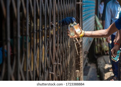 Mumbai / India 5 May 2020 Men Purchase Alcohol From A Government-controlled Outlet In A Prem Nagar Teen Dongri Goregaon West During Lockdown Period In Mumbai Maharashtra India