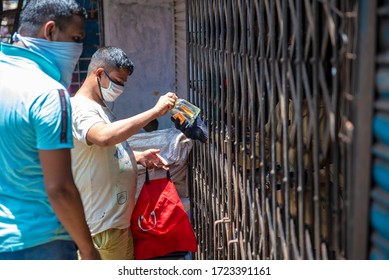 Mumbai / India 5 May 2020 Men Purchase Alcohol From A Government-controlled Outlet In A Prem Nagar Teen Dongri Goregaon West During Lockdown Period In Mumbai Maharashtra India