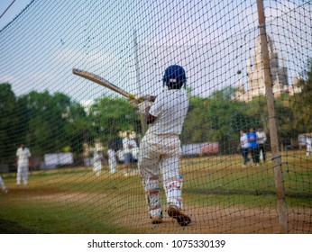 Mumbai, India - April 21, 2018: Unidentified boy practicing batting to improve cricketing skills at Mumbai grounds