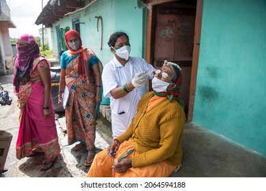 MUMBAI - INDIA - AUGUST 2, 2021: Health Workers Collects A Swab Sample From A Women For The Covid-19 Coronavirus Test At Village In Kolhapur.