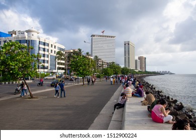 Mumbai, India, August 2019: A Large Amount Of People Roaming The Street Of Mumbai Near Marine Drive After A Heavy Rainfall Stops . Marine Drive Is A Famous Tourist Attraction In Mumbai.