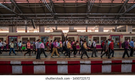 Mumbai, India - December 18, 2019 : Unidentified Passengers Walking On A Platform At Rush Hours Of CST Station, One Of The Bussiest Train Station For Working Class People In Mumbai