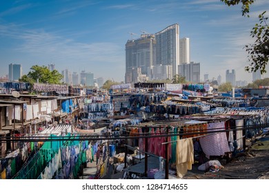 MUMBAI, INDIA -FEBRUARY 10, 2018: Mumbai's 140 Years Old Dhobi Ghat And Contrasting City Scape.