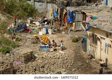 Mumbai, India - February 26, 2019: Indian Children Playing On The Street Near Garbage In Dharavi Slum At Mumbai. Top View