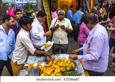 Mumbai, India - January 10th 2016 - Local People Eating Street Food In An Average Street Of South Mumbai, India, Asia.