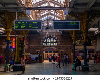 Mumbai, India - January 7, 2021 : Unidentified people inside one of the busiest station in Mumbai, Chhatrapati Shivaji Terminus. Relatively empty due to pandemic of Covid-19
