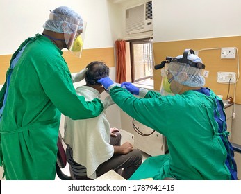 Mumbai, India - July 24 2020: ENT Doctors In PPE Examing A Patient In COVID Times