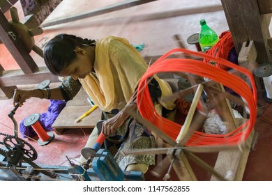 Mumbai, India - July 8, 2018 - Indian Craftwoman Weaving A Carpet