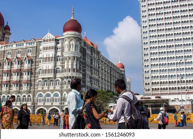 Mumbai India Nov 9th 2019: A Photographer Sells Service To Tourists In Front Of The Taj Mahal Palace Hotel, Is A Heritage, Five-star, Luxury Hotel Built In The Saracenic Revival Style In The Mumbai.
