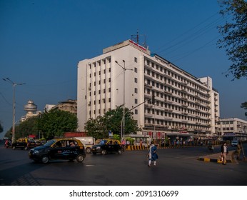 MUMBAI, INDIA - November 26, 2021 : Churchgate station,  the southern terminus on the Western Line of the Mumbai Suburban Railway and local taxis in Mumbai