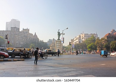 MUMBAI, INDIA - NOVEMBER 29: Taxis Drive On A Street On November 29, 2012 In Mumbai, India. The Architecture Of Mumbai Blends Gothic, Victorian, Art Deco And Indo-Saracenic Architectural Styles. 