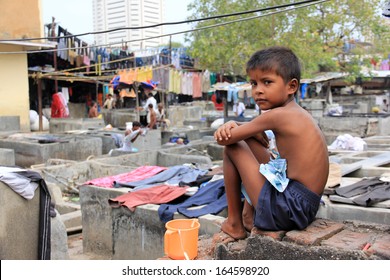 Mumbai, India - October 27, 2011: Dhobi Ghat Is A Well Known Open Air Laundromat In Mumbai, India. The Washers Work In The Open To Wash The Clothes From Mumbai's Hotels And Hospitals.