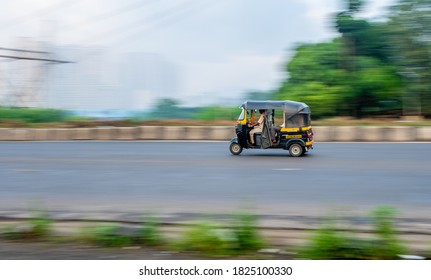 MUMBAI, INDIA - September 20, 2020 : An Auto Rickshaw Driver Wearing Protective Mask During Covid-19 Pandemic, Famous Three Wheel Public Transport In Mumbai