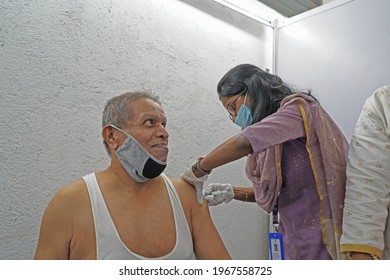 Mumbai, Maharashtra, India - 05 04 2021: Old Man Gets Vaccinated With COVID-19 Covishield Vaccine Manufactured By Serum Institute Of India (SII) At The Dadar Center 