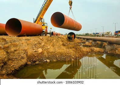  Mumbai Maharashtra India April 29,2007 Large Steel Pipes Laying By Crane For Drinking Water Project Under Town Planning In  Navi Mumbai,New Bombay,Maharashtra ,India,Asia 