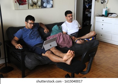 Mumbai Maharashtra India Asia Aug. 12 2018  Work From Home Concept Indian Father And Son Working On Laptop At Home