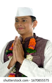 Mumbai; Maharashtra; India- Asia; Dec. 26, 2009 - Indian young handsome politician greeting traditional welcome pose namaste on white background