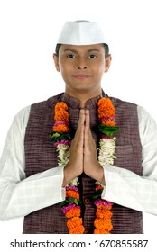 Mumbai; Maharashtra; India- Asia; Dec. 26, 2009 - Indian young handsome politician greeting traditional welcome pose namaste on white background