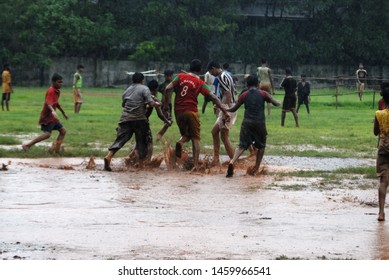 223 Kids Playing Football In Rain Images, Stock Photos & Vectors ...