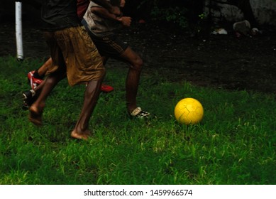 Kids playing football in the rain Stock Photos, Images & Photography ...