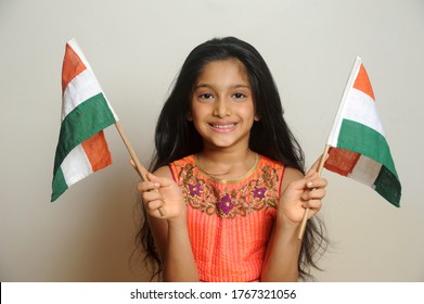 Mumbai, Maharashtra, India, Asia, June. 27, 2020 - Cute Little Girl With Indian National Tricolour Flag, Celebrating Independence Or Republic Day Girl In Traditional Dress With Long Hair    