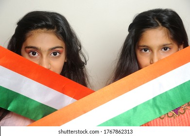 Mumbai, Maharashtra, India, Asia, June. 27, 2020 - Cute Little Girls With Indian National Tricolour Flag, Celebrating Independence Or Republic Day Girl In Traditional Dress With Long Hair    