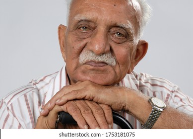 Mumbai, Maharashtra, India- Asia, May, 25, 2007 - Closeup Of South Asian Indian Eighty Years Happy Old Man Resting On Walking Stick