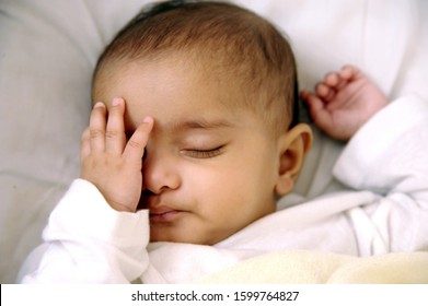 Mumbai, Maharashtra, India- Asia, Sep. 2011- Sweet Sleep Portrait Of Six Months Indian Little Cute Baby Sleeping On White Bed