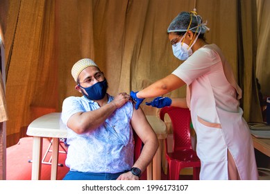 Mumbai, Maharashtra, India - CIRCA May 2021: A Dawoodi Bohra Member Gets Vaccinated For Covid-19  During The Coronavirus Pandemic In Mumbai, Maharashtra, India 