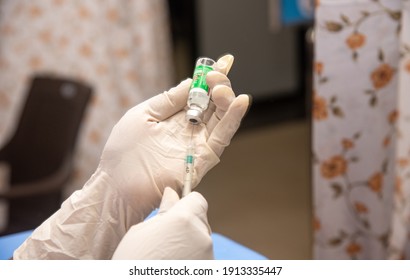 MUMBAI, MAHARASHTRA, INDIA - Feb 08, 2021: A Medical Worker Draws A Dose Of A Covishield, AstraZeneca's Covid-19 Coronavirus Vaccine From A Vial For Front Line Workers At The Shatabdi Hospital.