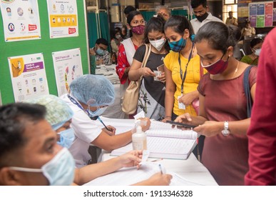MUMBAI, MAHARASHTRA, INDIA - Feb 08, 2021: Police and health worker wait in queue for registration of Covid-19 coronavirus vaccine during the 2nd phase of vaccination drive at Shatabdi Hospital.